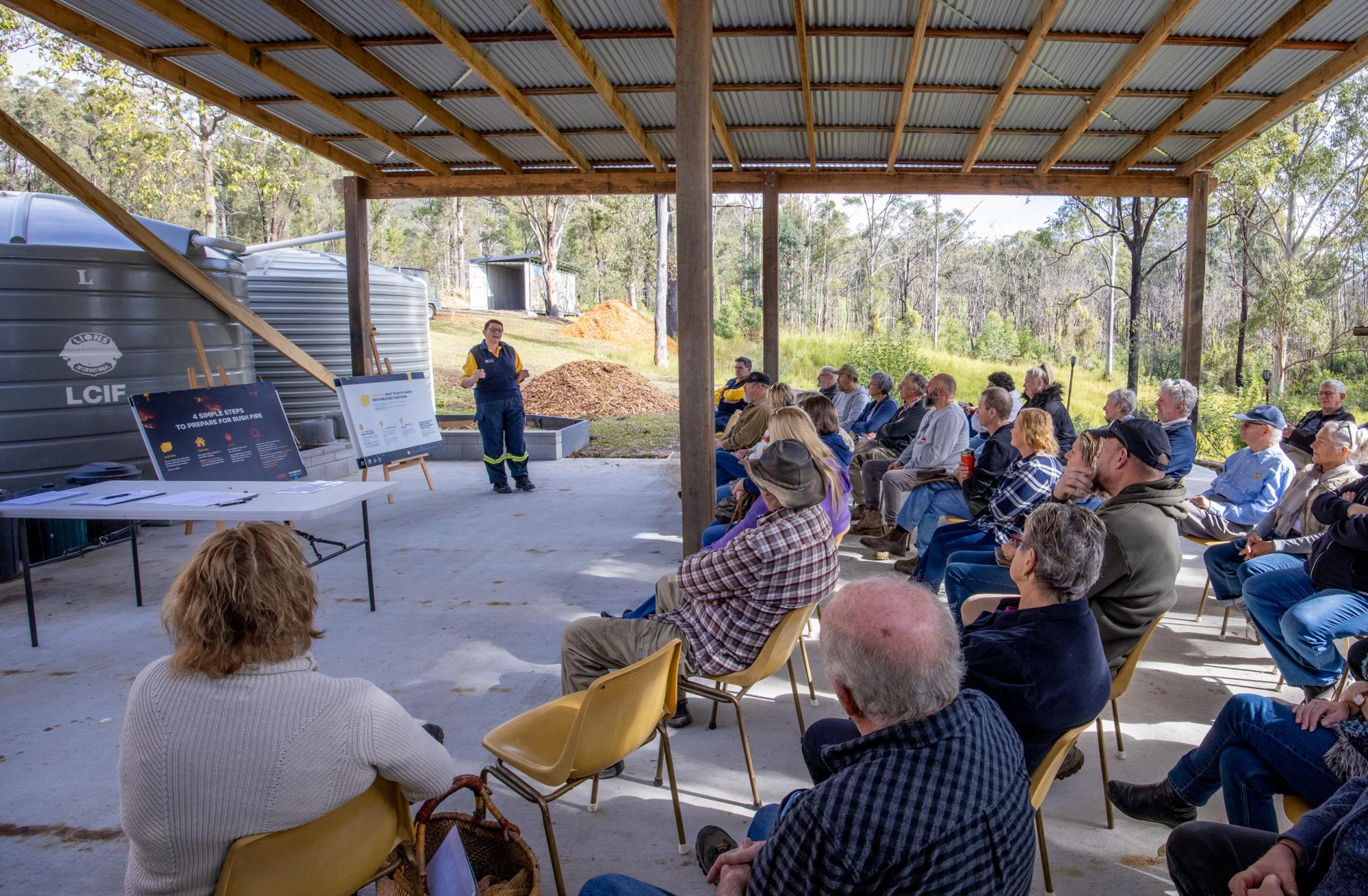 Kirsty Channon, District Officer of the Rural Fire Service, provides an evacuation and fire protection training to the Bobin community. Members of the Rotary Club of Taree on Manning, Australia, and the New South Wales Rural Fire Service in Taree help the communities of Bobin and Caparra prepare for bushfires by providing evacuation and fire protection training, erecting an automated sign accessible to both communities that indicates the level of fire danger, and installing tanks so bushfire brigades have water supplies. This project is supported by the Rotary Clubs of Tarree on Manning and of Windsor-Roseland, Canada, and by a Rotary Foundation Global Grant GG2015686. 24 July 2022. Bobin, New South Wales, Australia.